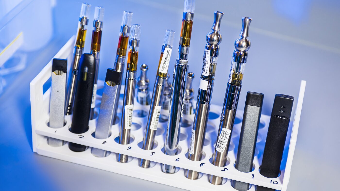 This image depicted a test tube rack that had been stocked with examples of various electronic cigarettes, referred to as e-cigarettes, or e-cigs, and vaping pens. These items would undergo testing inside a Centers for Disease Control and Prevention (CDC) laboratory environment.